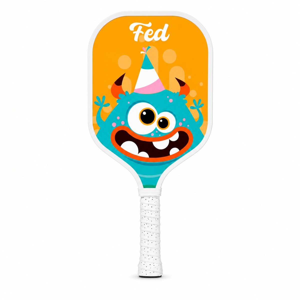 Raquette de pickleball enfant orange avec illustration de monstre souriant nommé Fed, vue de face